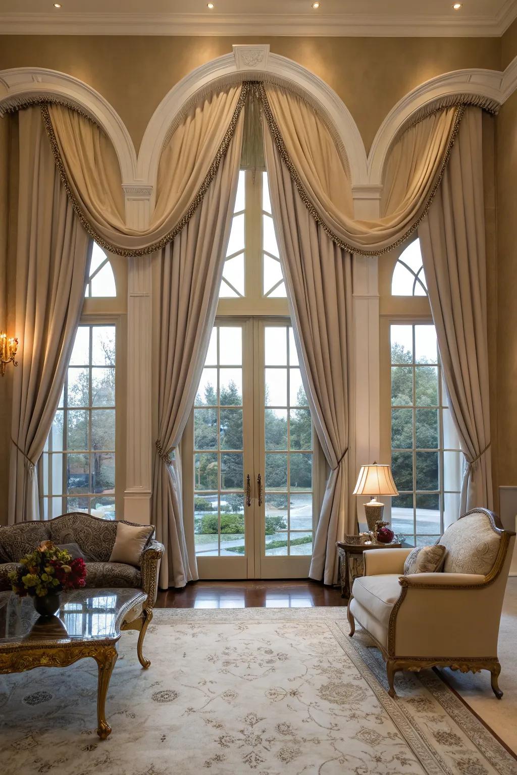 Elegant living space featuring refined drapes that highlight arched windows.