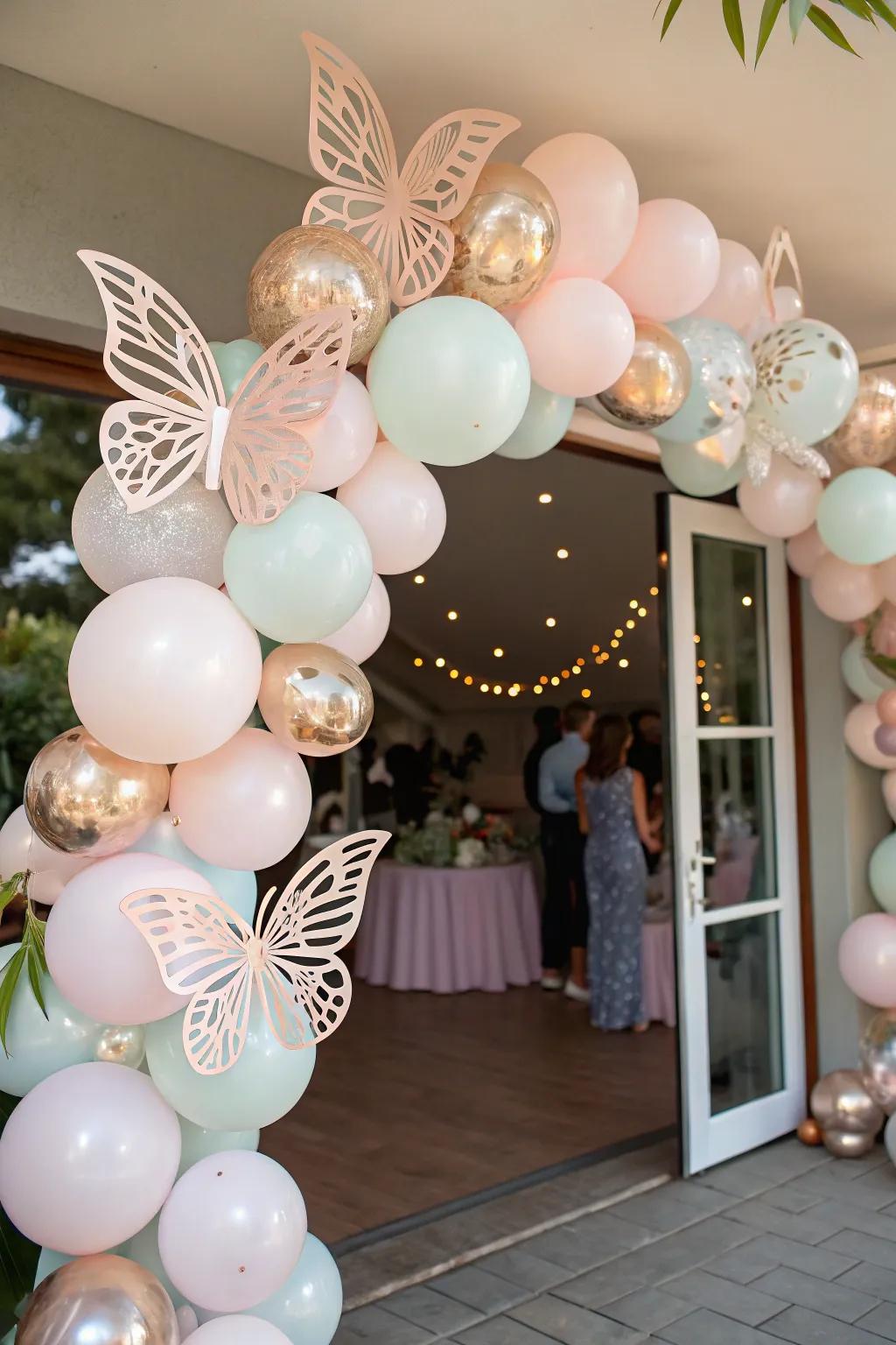 A delightful balloon garland decorated with butterflies, inviting guests to the party.
