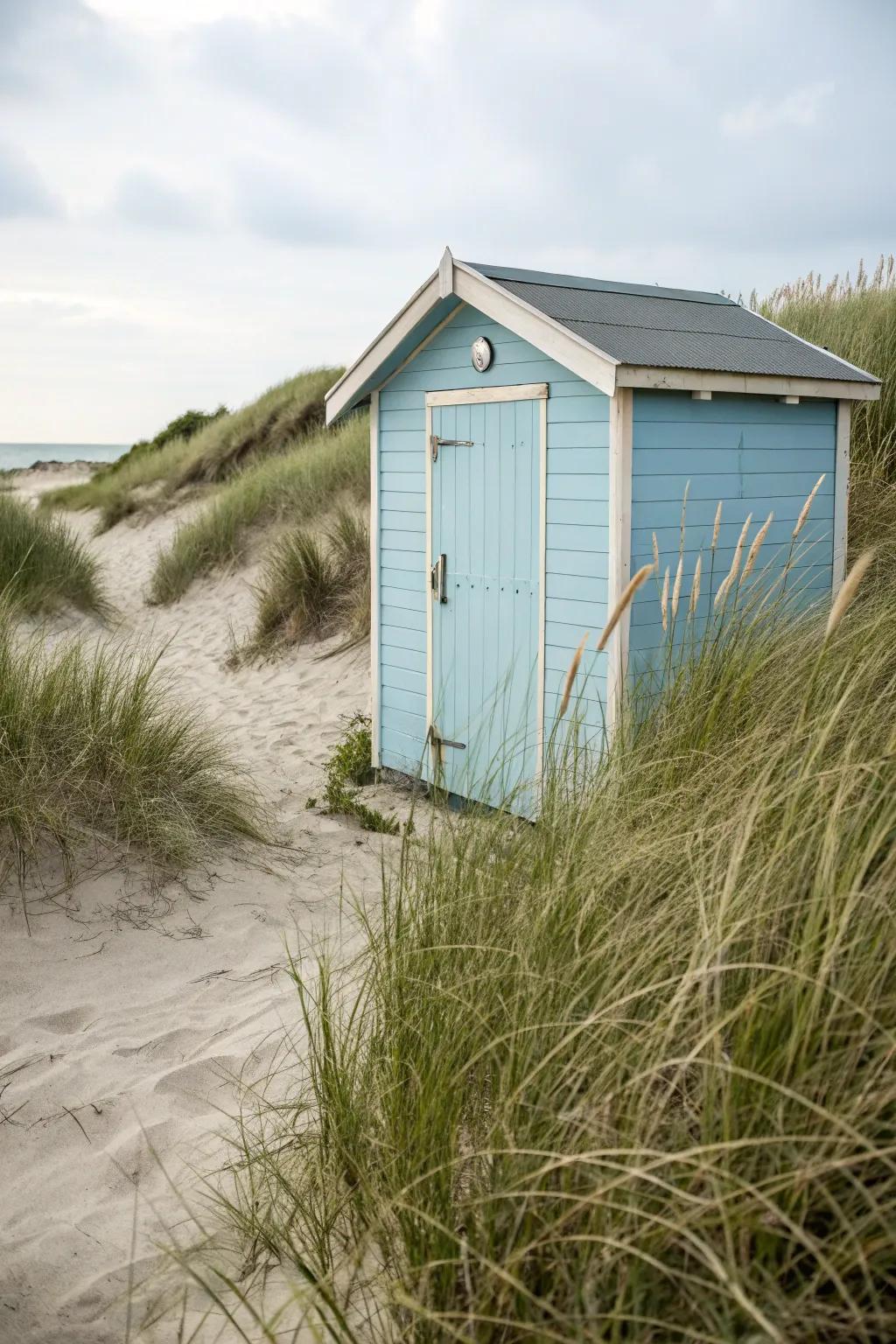 An outbuilding painted in soothing seaside colors for a crisp coastal aesthetic.