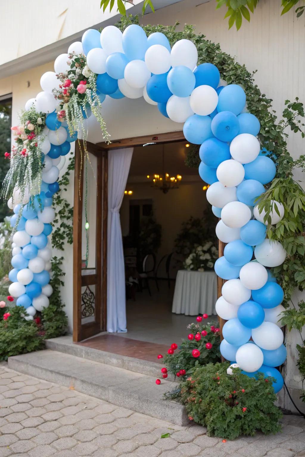 A welcoming blue and white balloon arch establishes the event's ambiance.