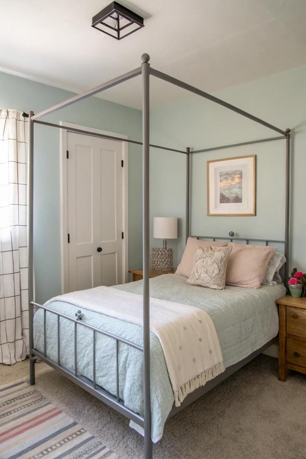 A minimalist metal four-poster frame adds sophistication without visual clutter.