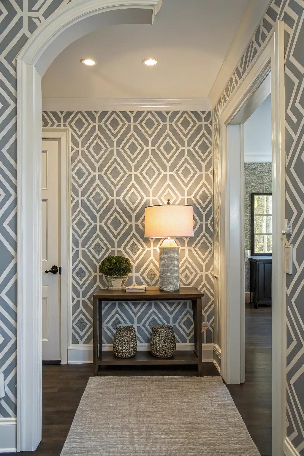 A modern entryway showcased bold geometric wallpaper, exuding a contemporary ambiance.