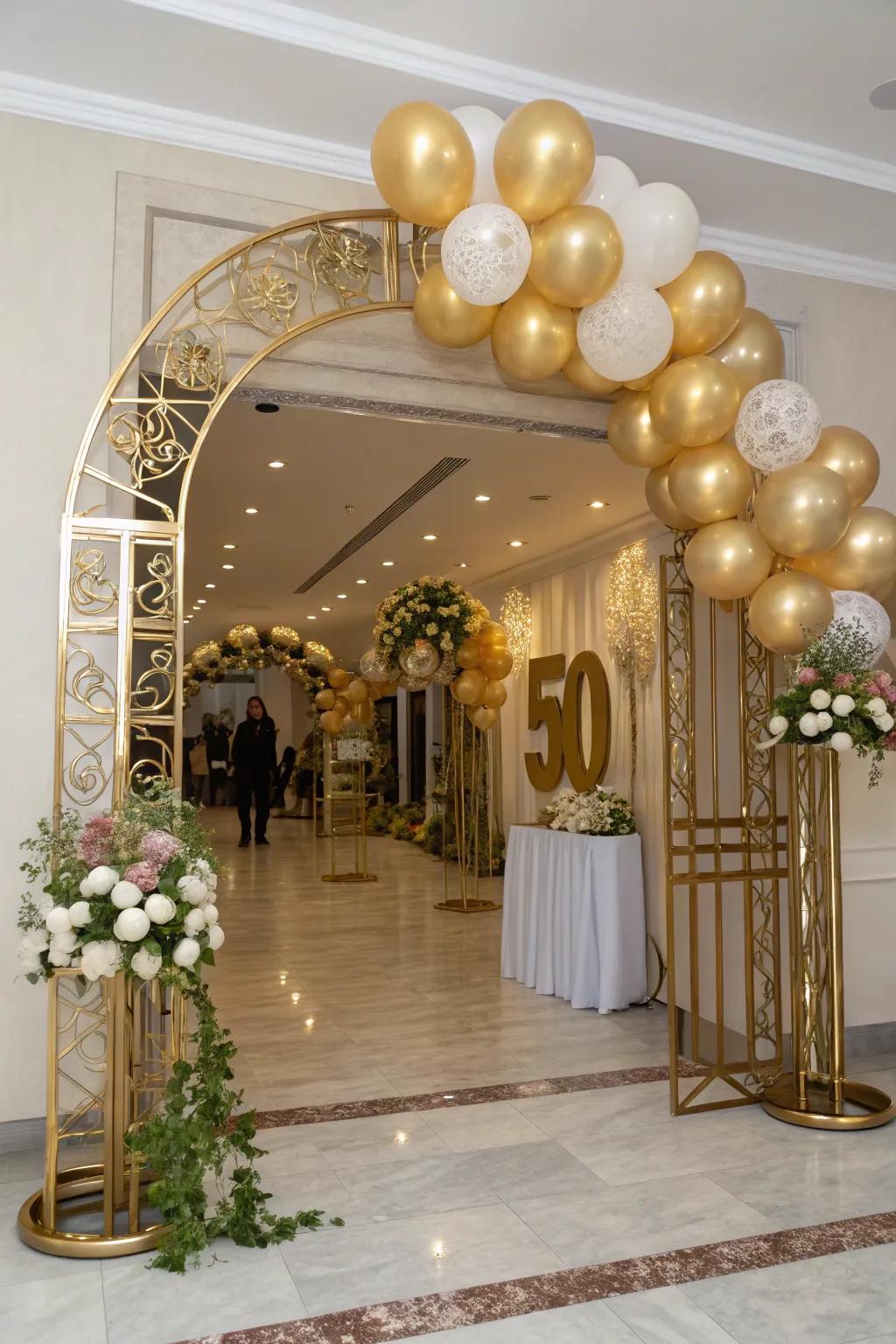 A magnificent gold balloon entrance welcomes guests to the celebration.