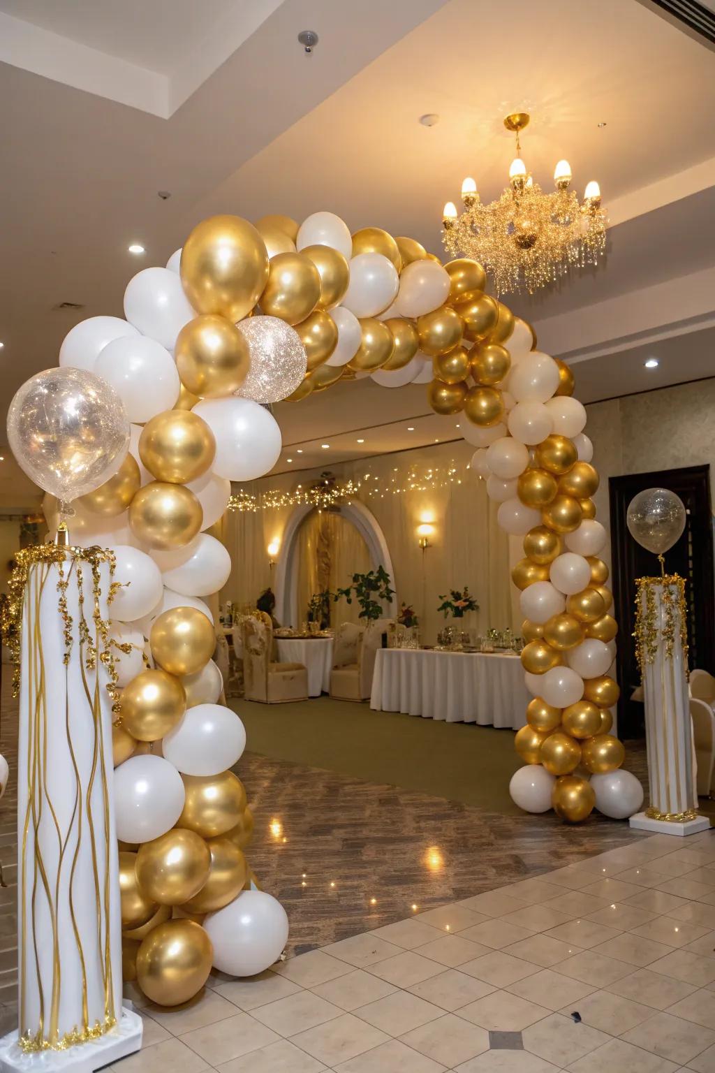 An exquisite golden sphere arch serves as a splendid entrance for a birthday celebration.