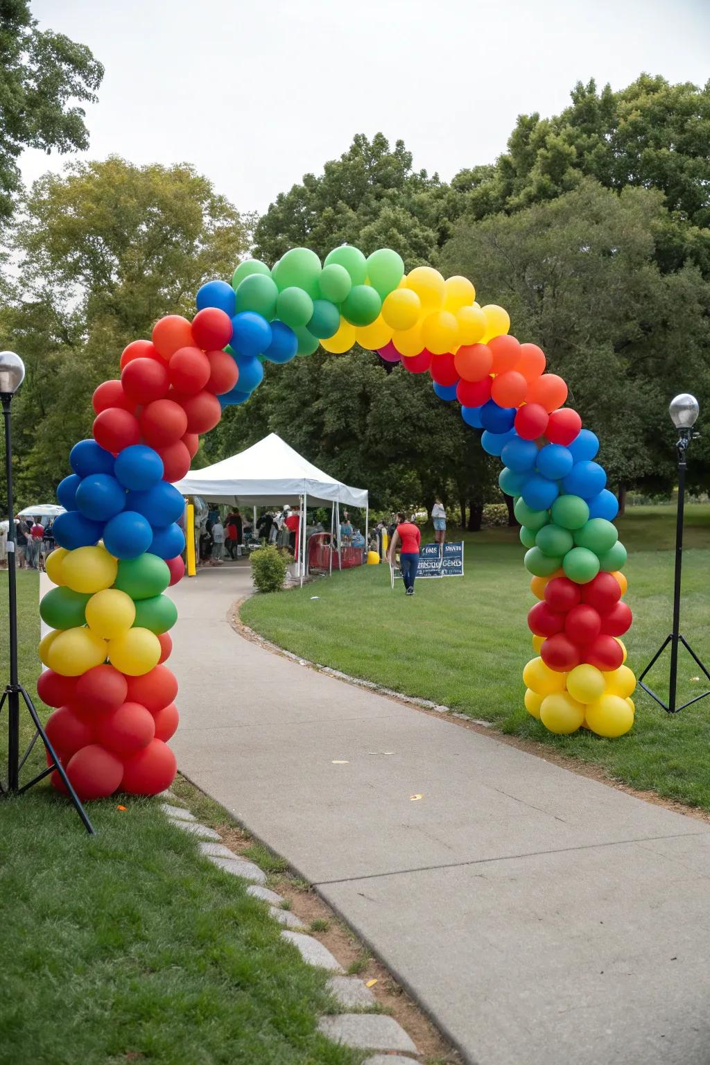 A vibrant balloon arc establishes a cheerful vibe for a park gathering.