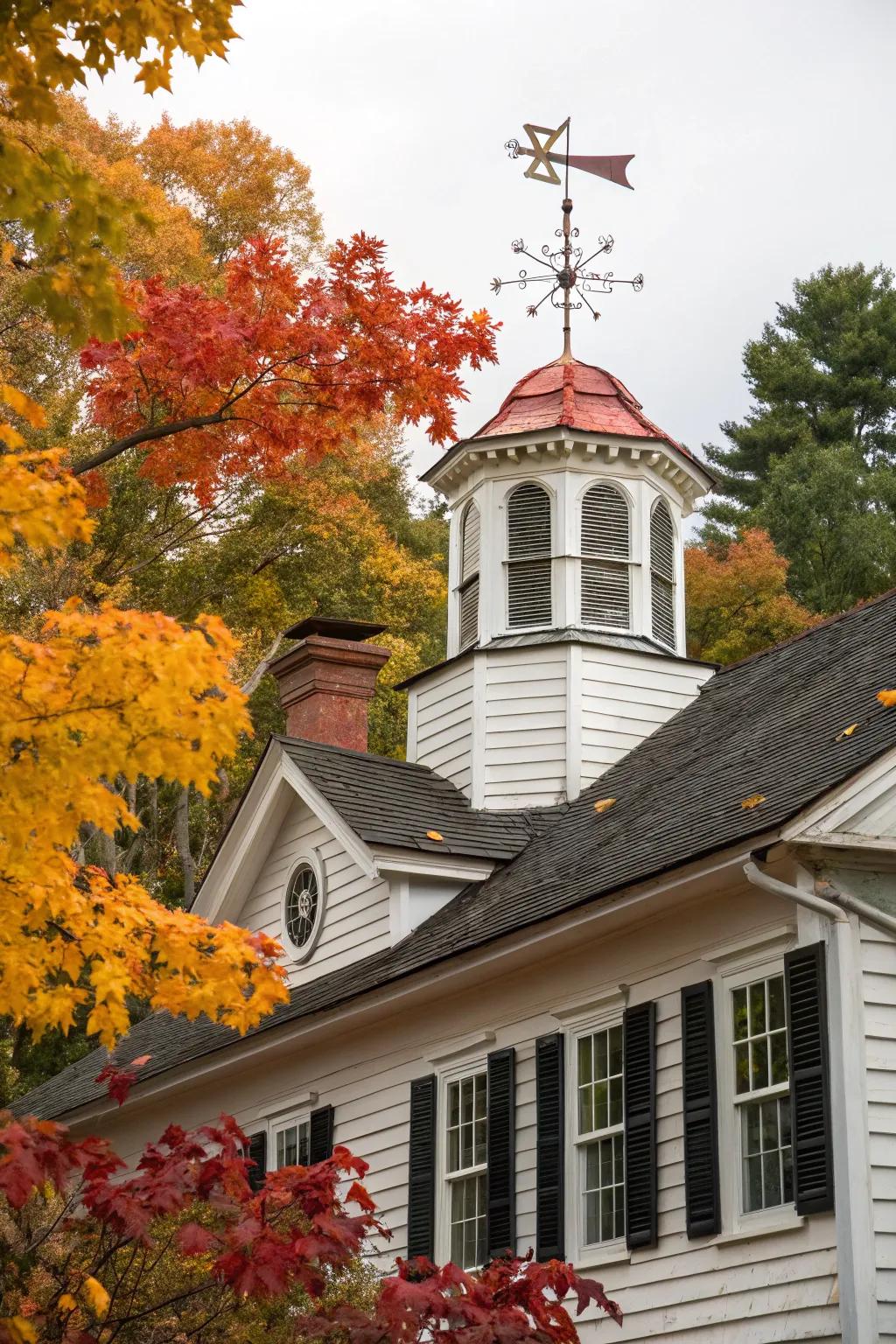 An elegant Colonial home enhanced by a timber cupola and traditional weather indicator.