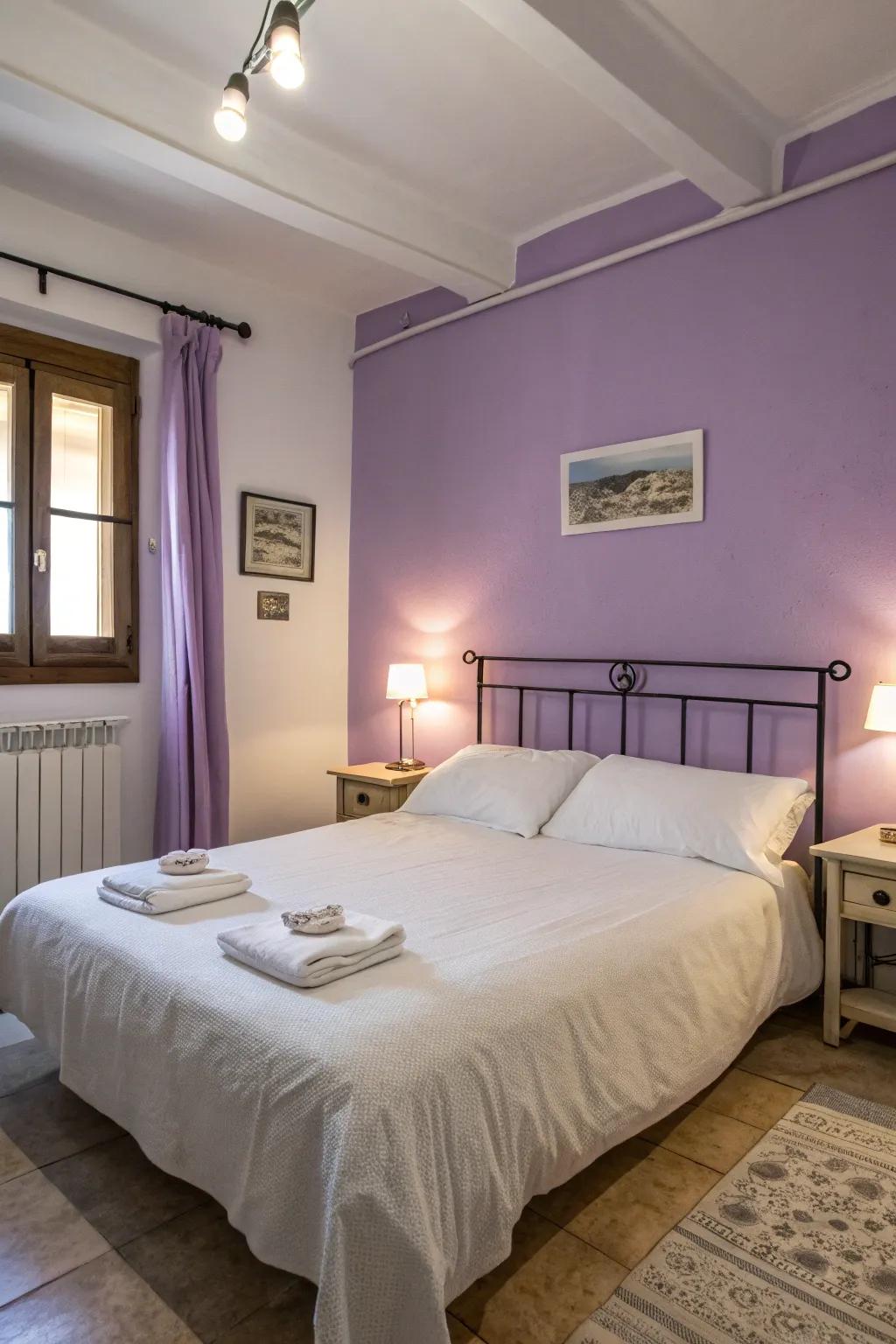 A peaceful bedroom featuring lavender walls and crisp white bedding.