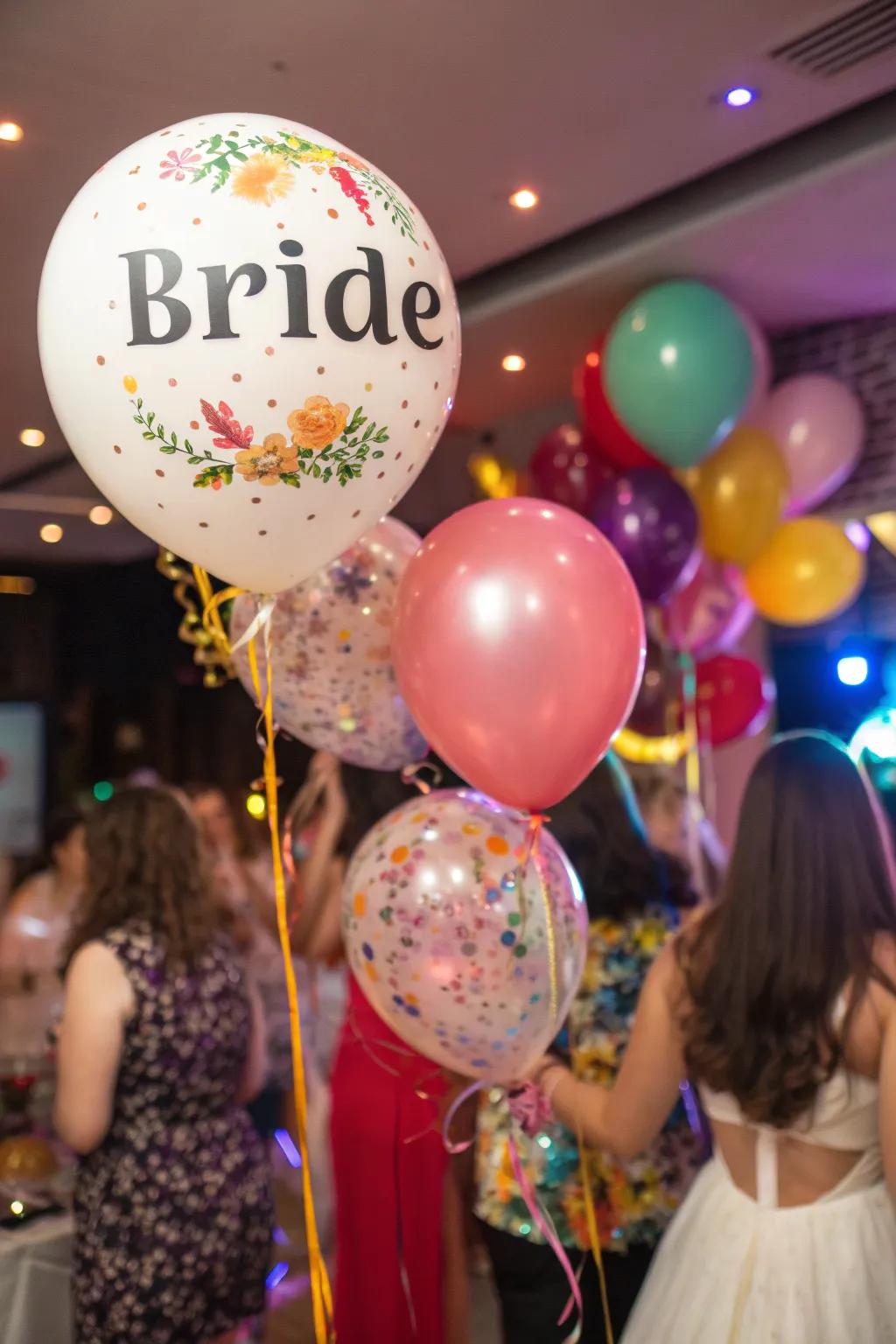 Personalized air-filled spheres displaying the bride’s name.