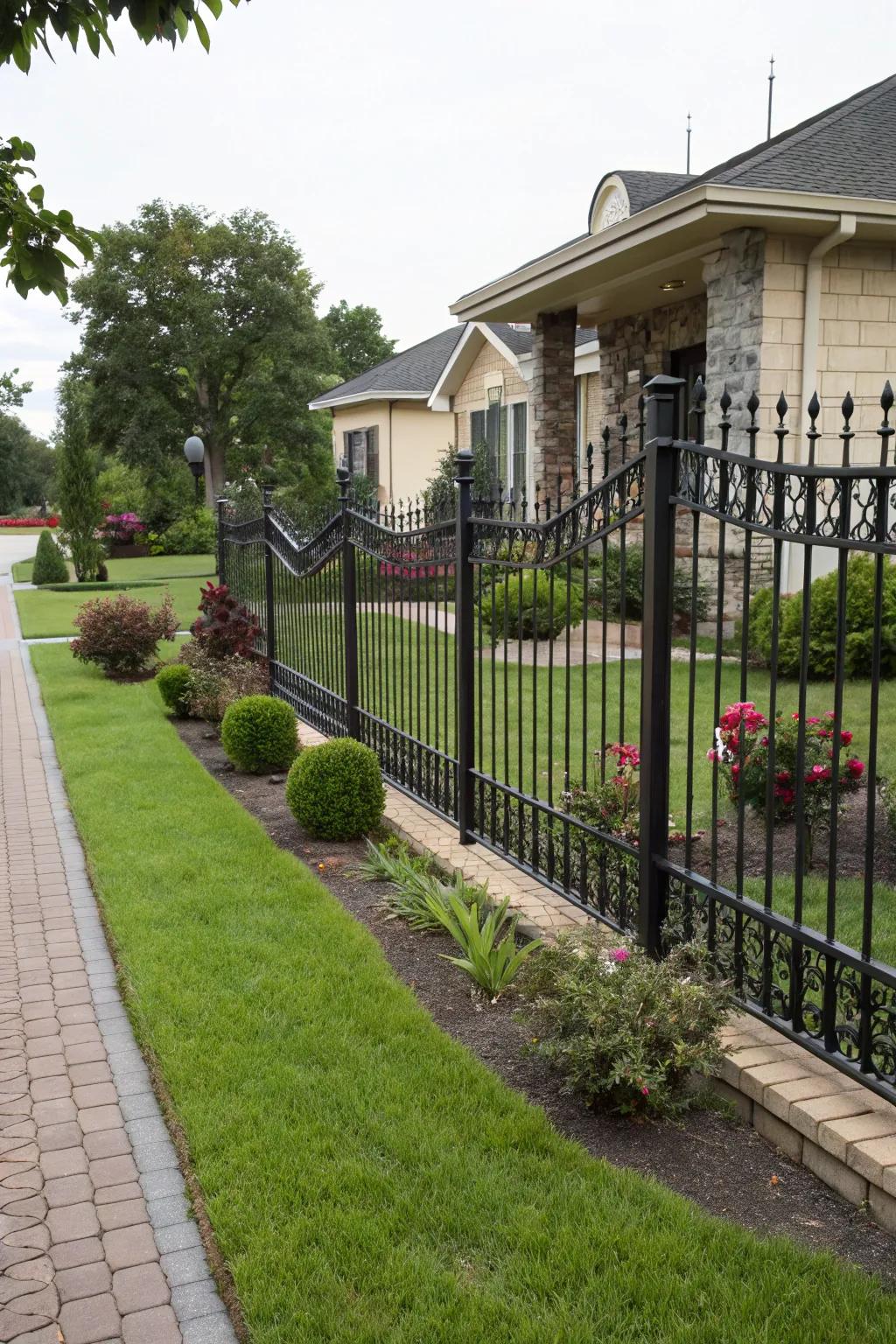 An enclosed decorative metal fence ensuring privacy in a stylish front yard.