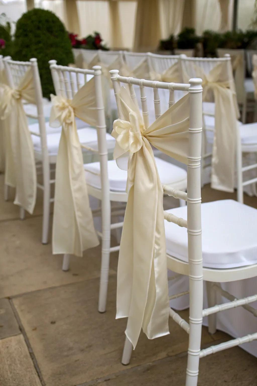 Silken ribbons introduce an amorous nuance to chairs.
