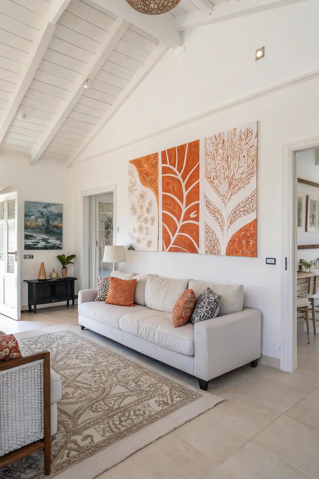 Orange and white artwork brings cohesion and style to a living room.