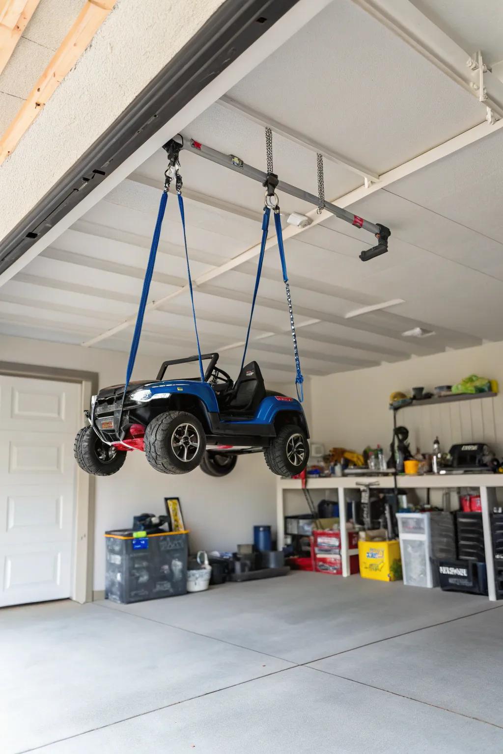 Hanging straps suspending motorized toy vehicles to clear floor space.