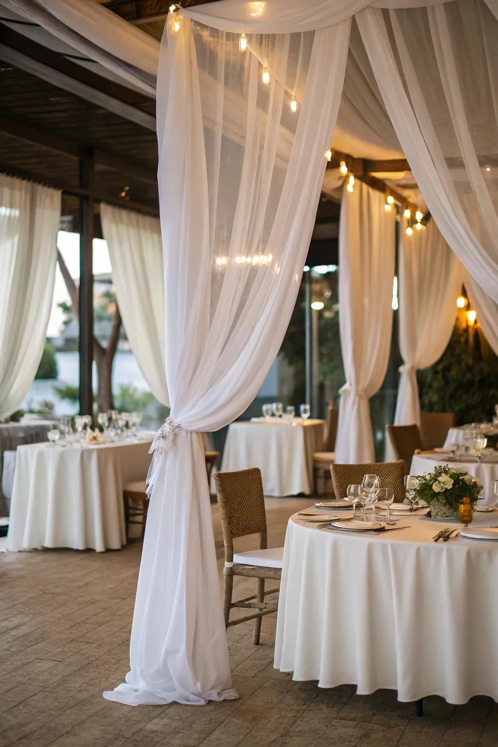 White fabric panels enhance the dinner setting with elegance and drama.