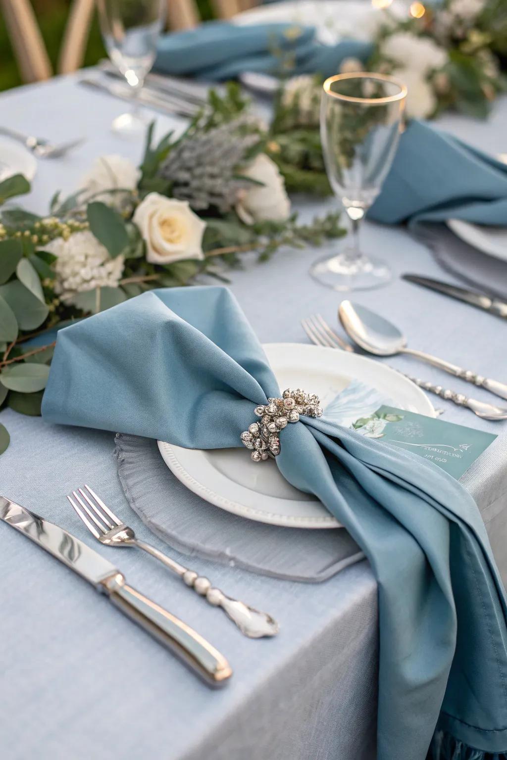 A refined table arrangement exhibiting hazy azure napkins that elevate the dining encounter.