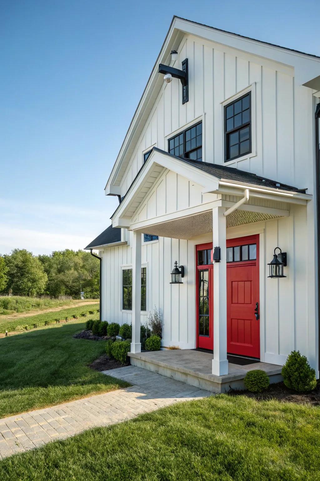 Modern farmhouse featuring a red entrance, combining tradition with modernity.