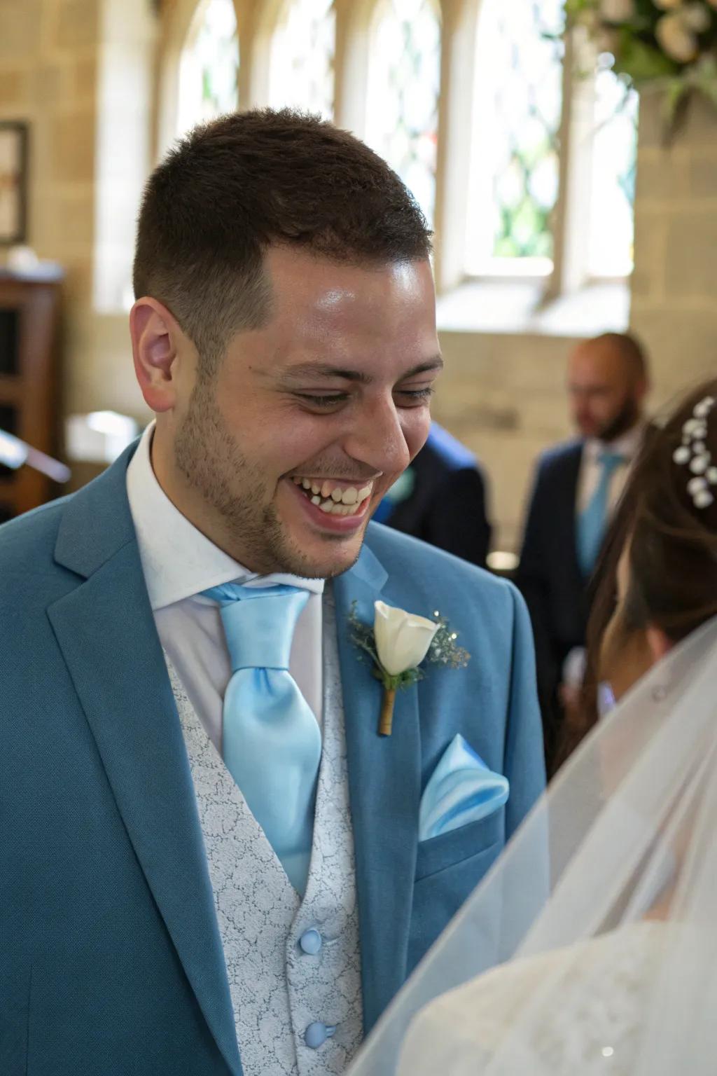 Soft blue accessories contribute a fashionable element to the groom's attire.