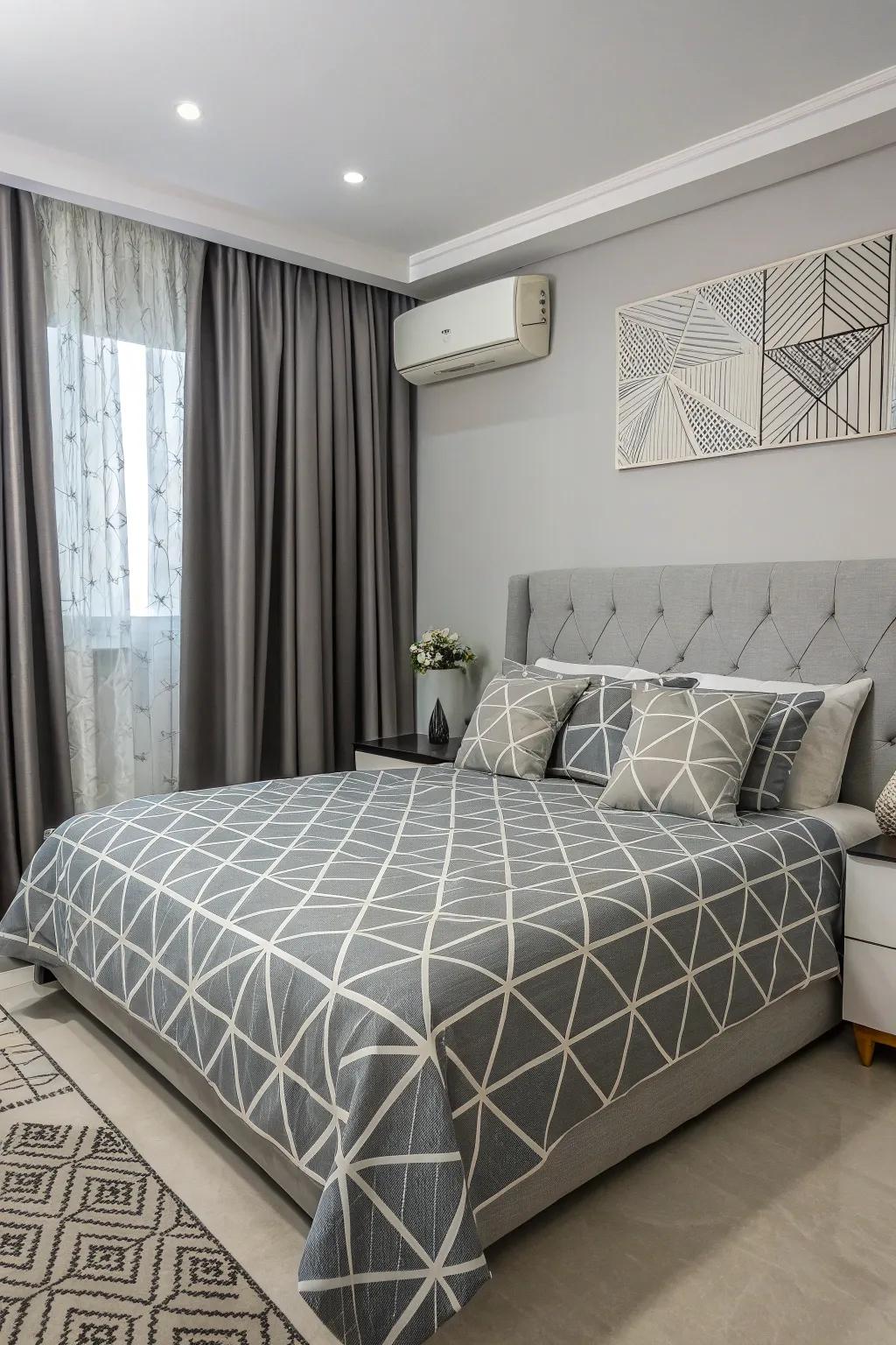 Geometric patterns give the grey bedroom a modern twist.