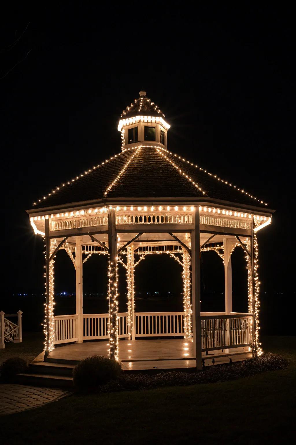 Strand lights highlighting the gazebo's structural form.