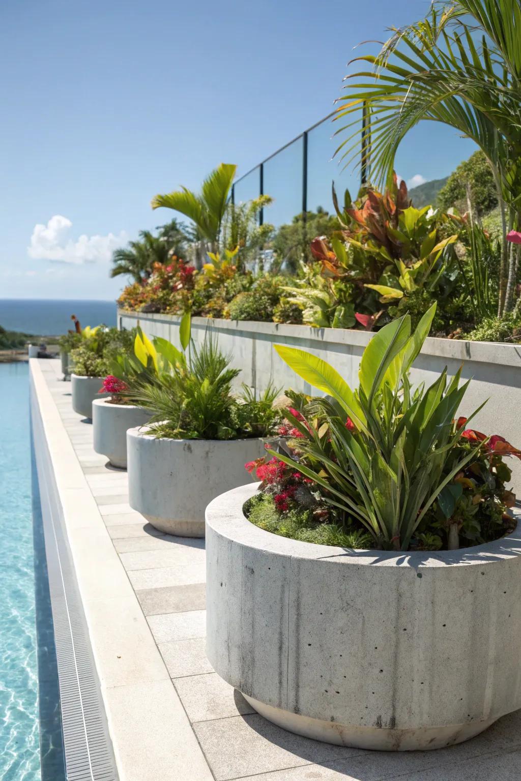 Concrete planters bring greenery and style to the poolside.