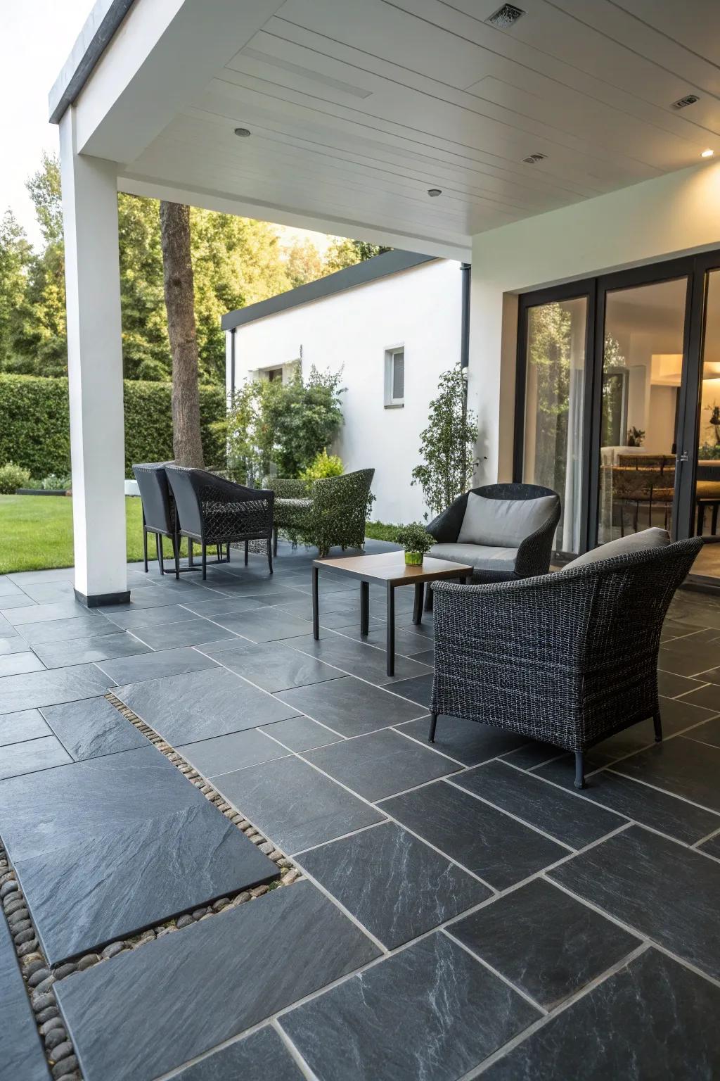 Slate tiles rendering a polished, modern patio aesthetic.