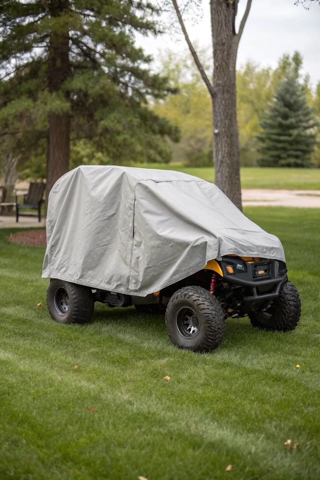 Custom-fit covers protecting outdoor-stored motorized toy vehicles.