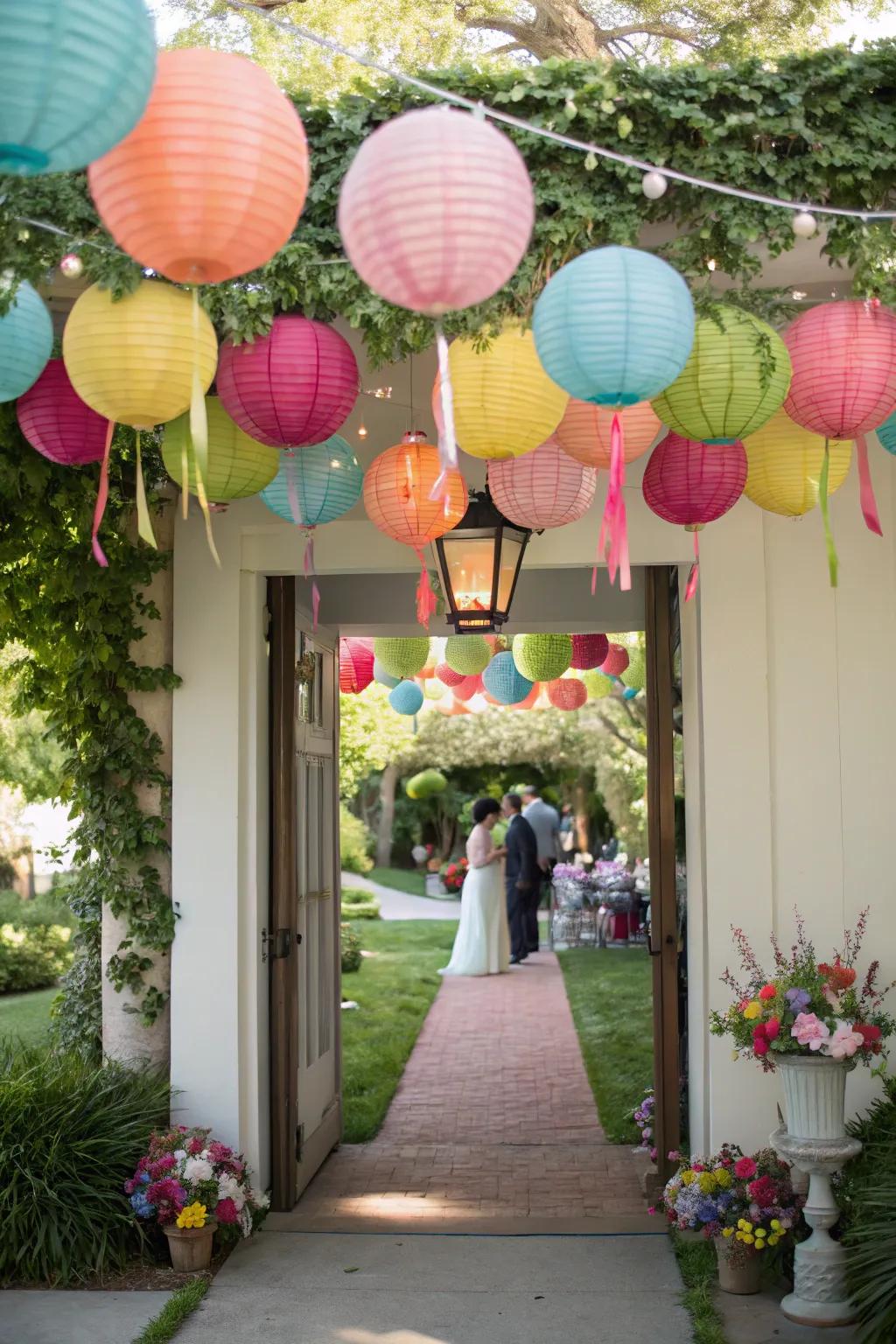 Festive paper beacons impart a splash of hue and joy to the bridal shower doorway.
