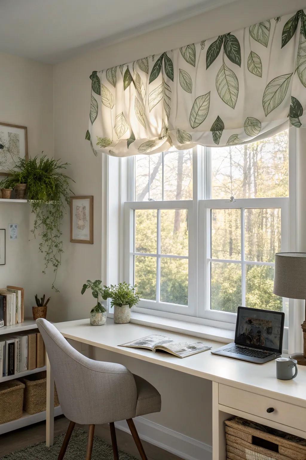 A tranquil home office featuring a window with a nature-inspired valance.