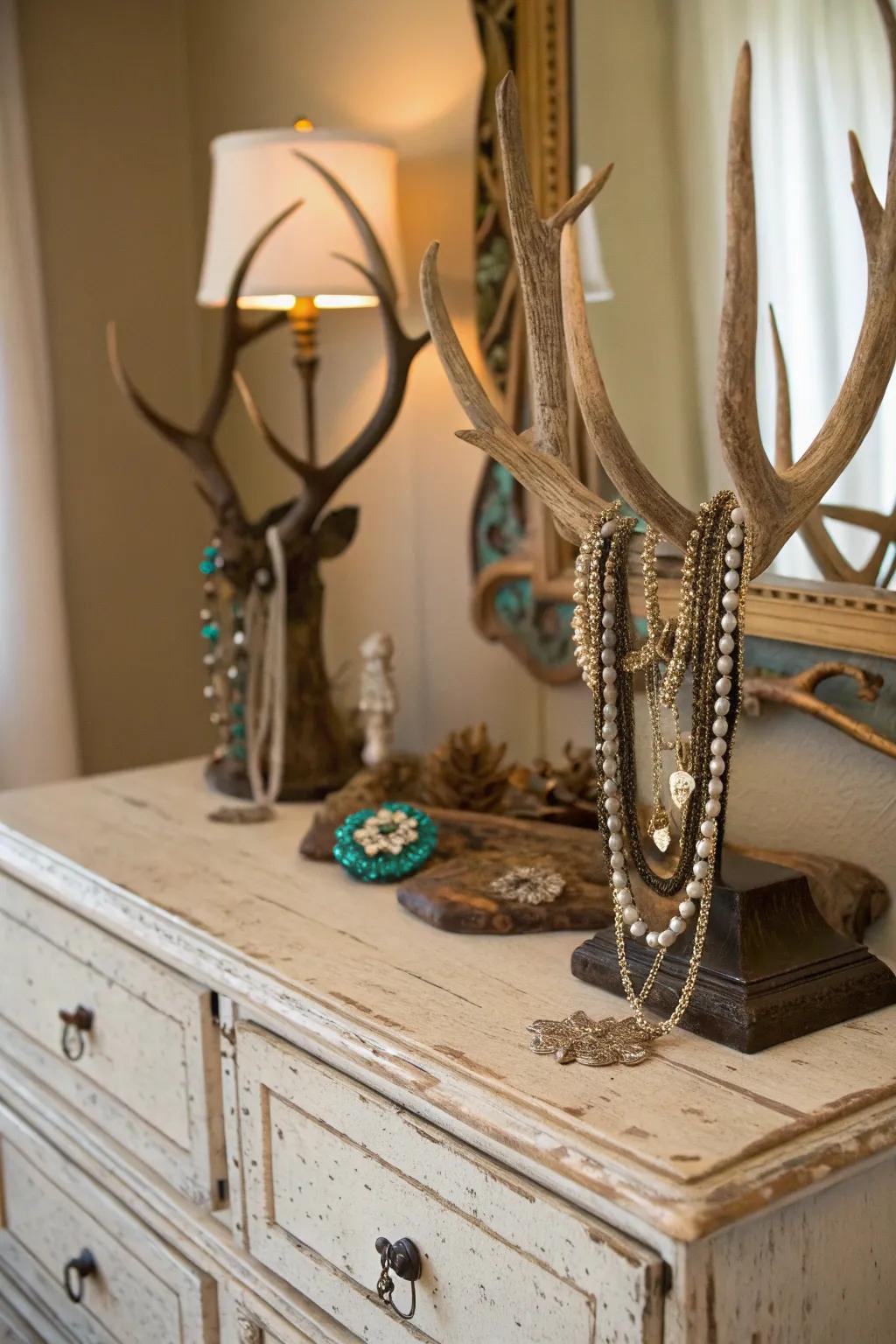 Deer antlers utilized as a jewelry display bring functional style to an antique dresser.