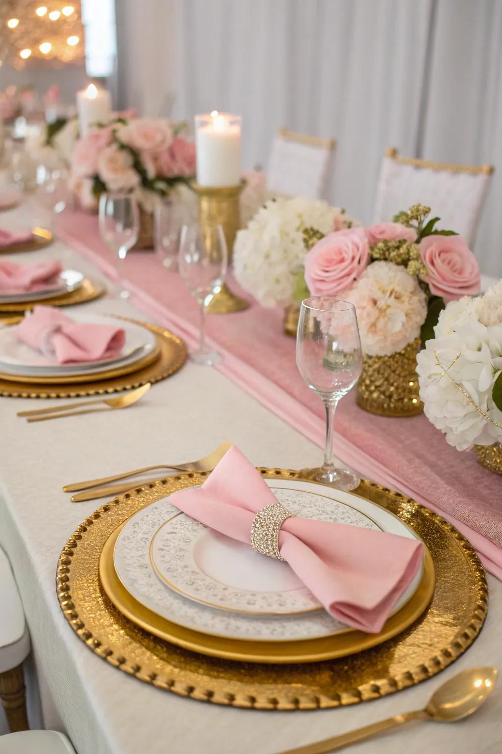 An elegant table arrangement in the colors of pink, gold, and white.