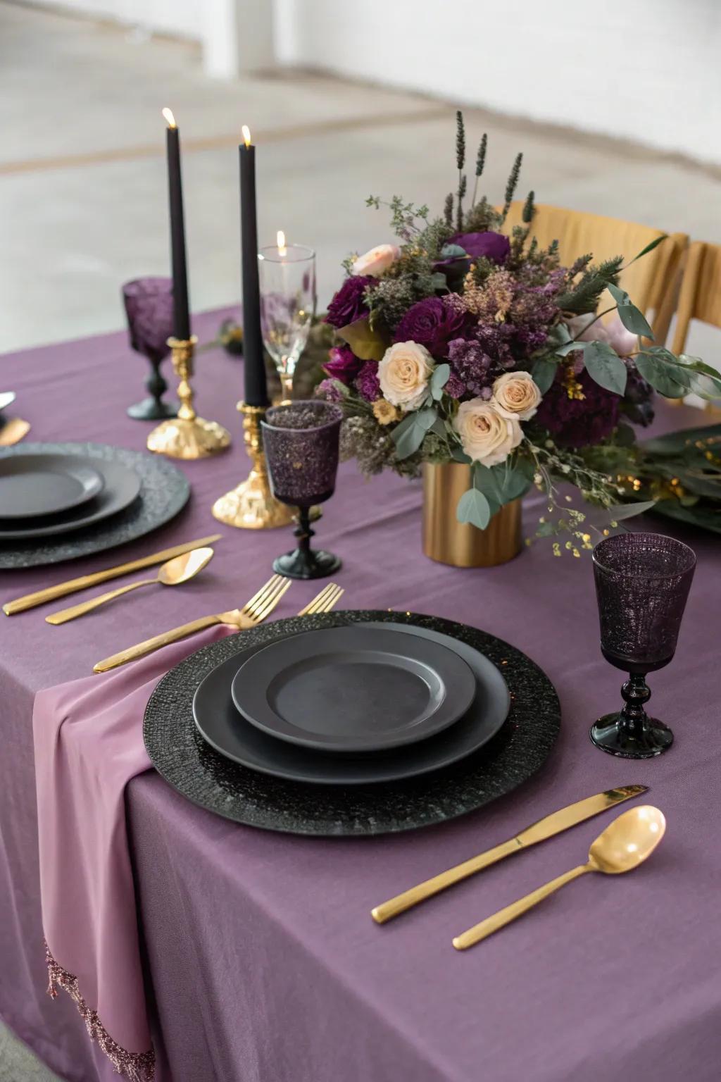 An elegant table arrangement displaying violet linens and ebony dinnerware.