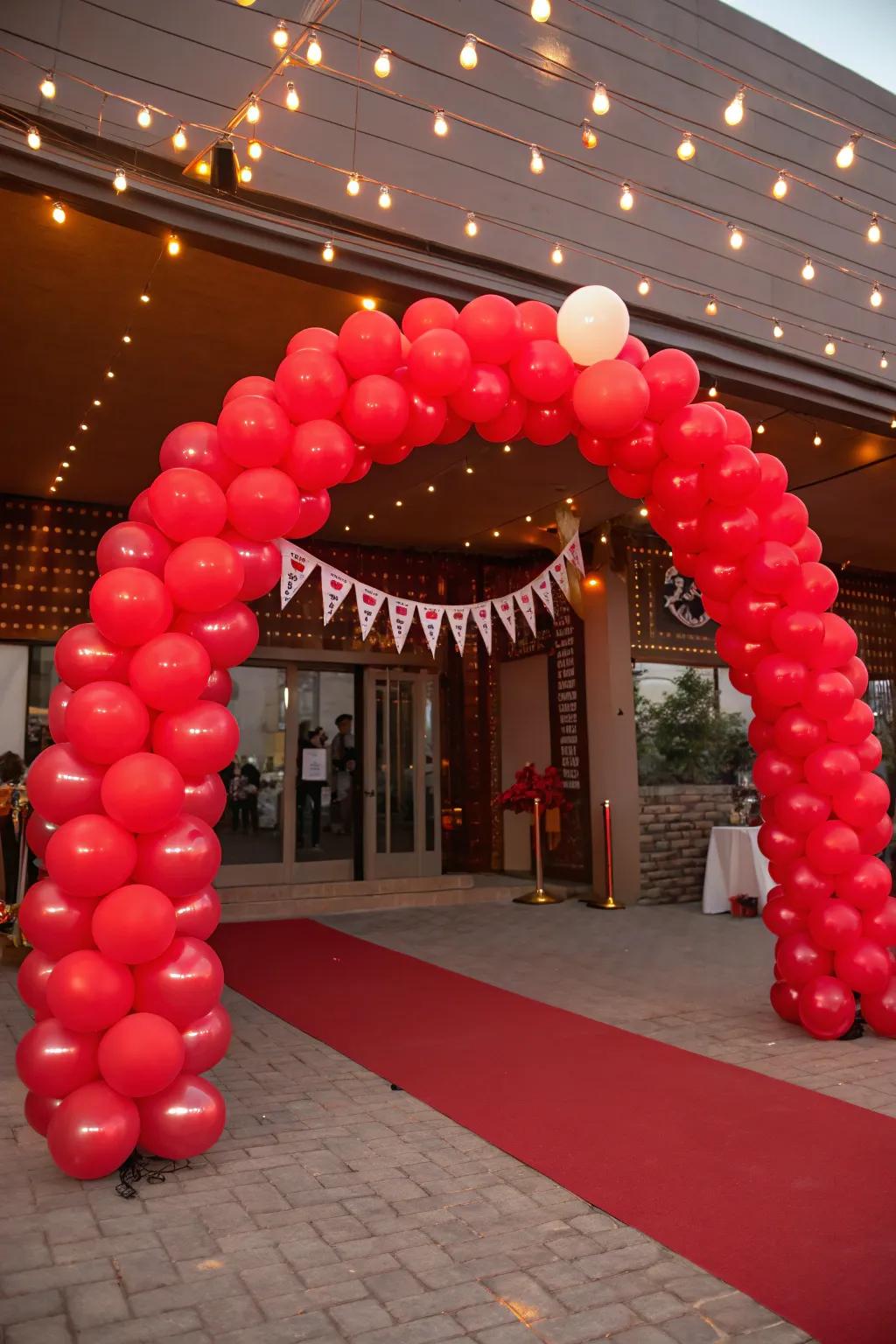 A vermilion balloon arch creating a magnificent entrance.