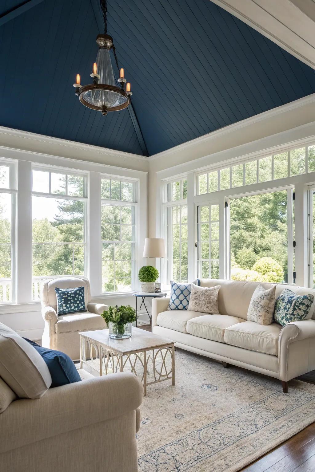 A living room that feels deeper, thanks to its dark blue ceiling.