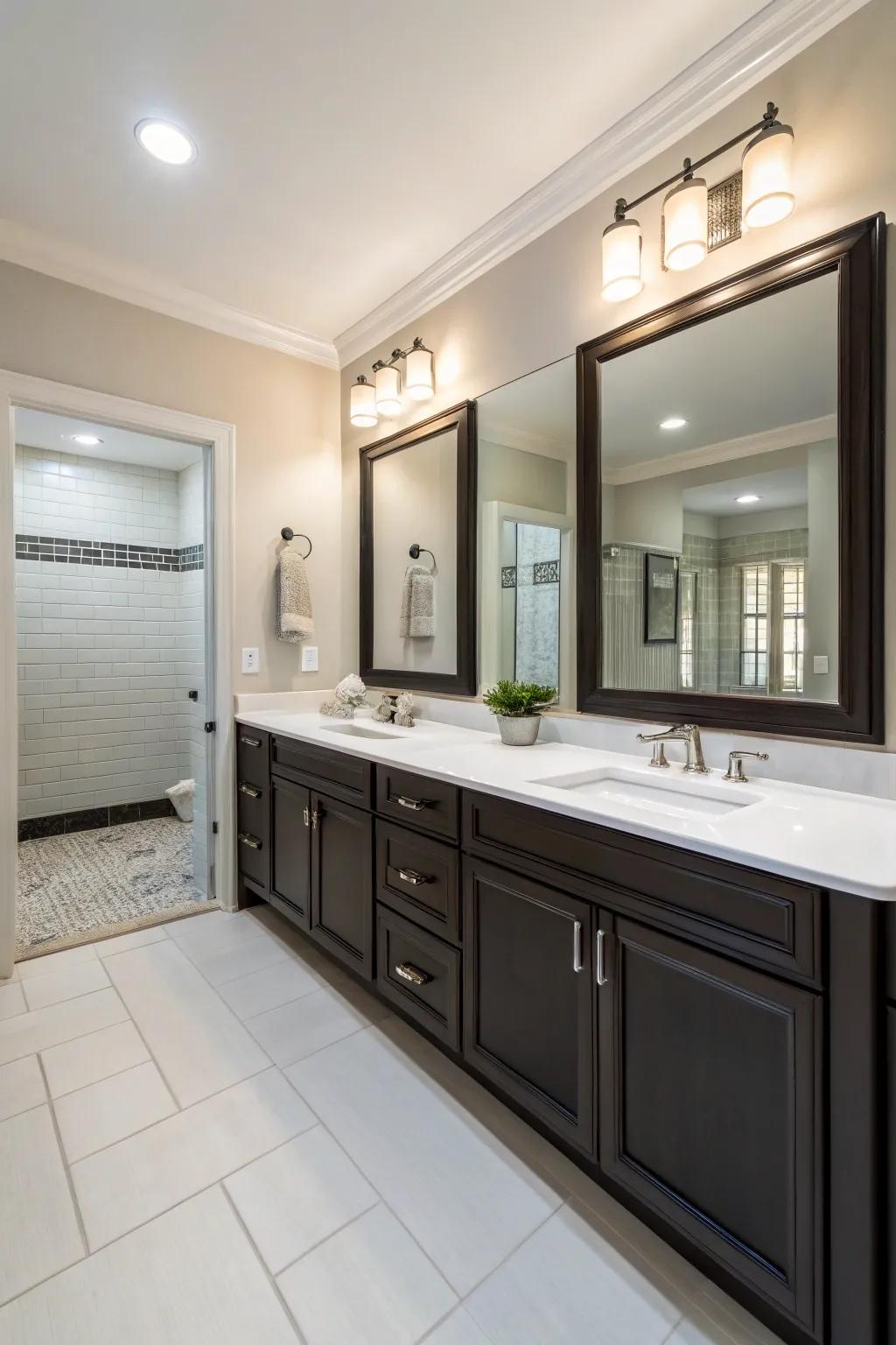 A double vanity bathroom showcasing a soft palette accented by deep-toned cabinetry.