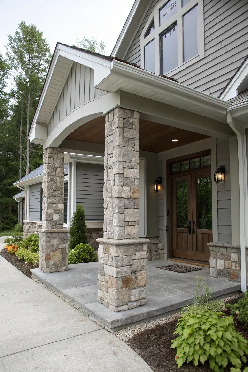 Impressive entrance featuring grey tones and stone columns.