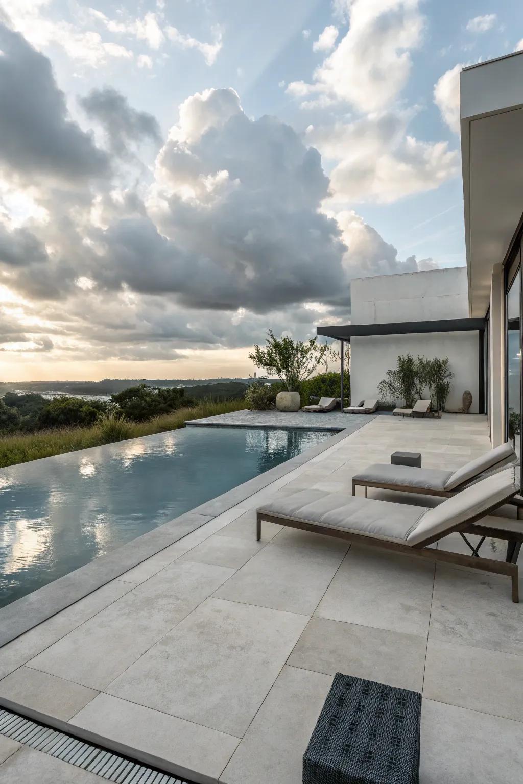 Concrete pavers provide a modern touch to your poolside design.