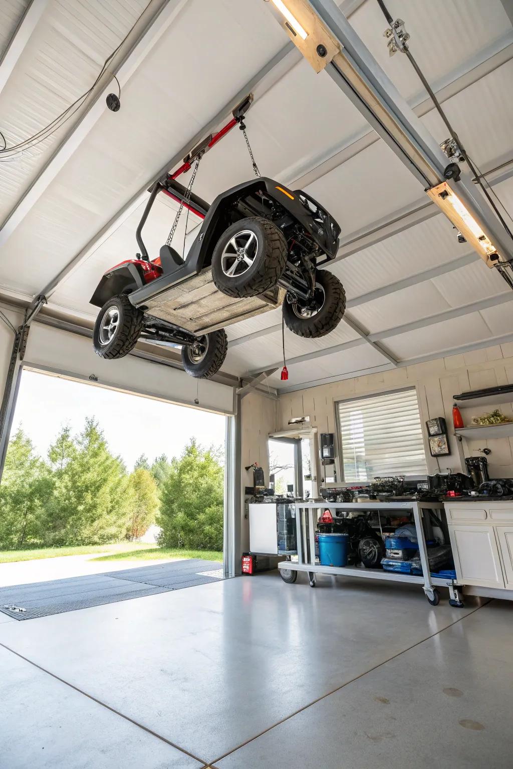 Ceiling hoist system lifting a motorized toy vehicle to maximize space.
