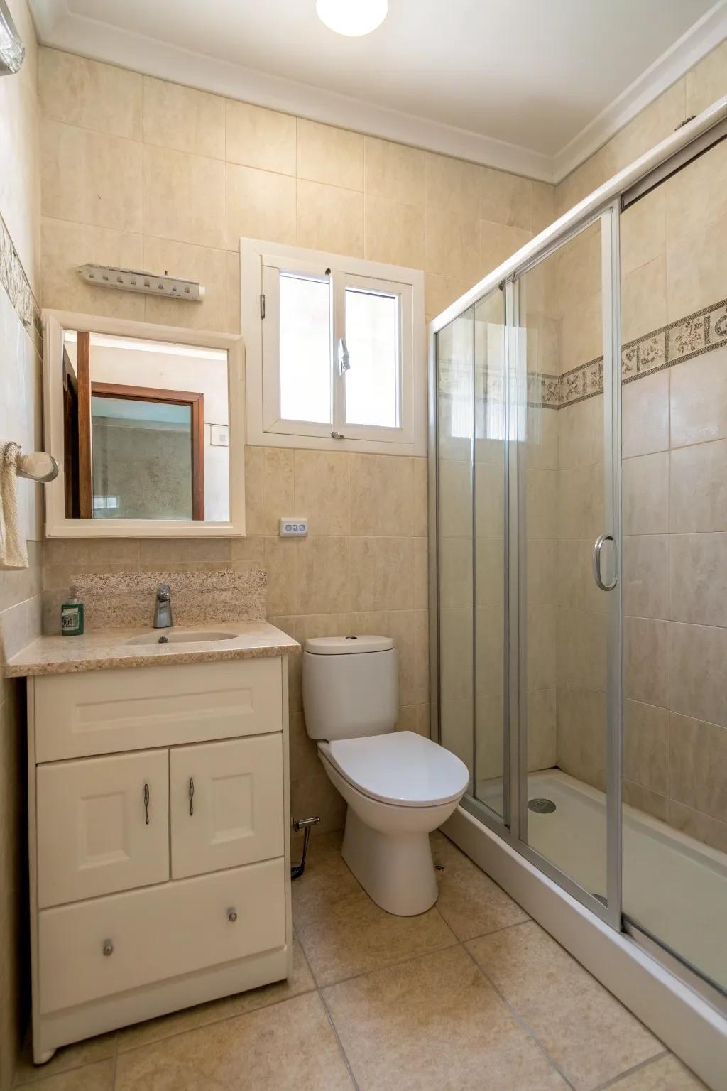 A minimalist beige bathroom defined by clean lines and understated decorations.