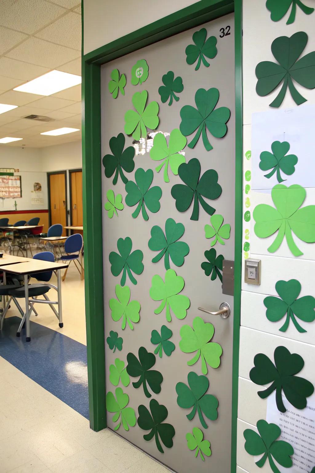 A classroom door beautifully decorated with green shamrocks, ideal for St. Patrick's Day.