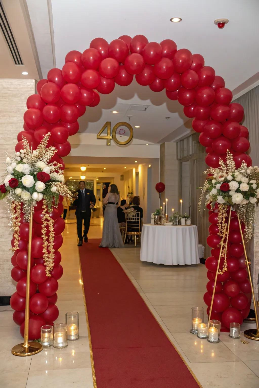 A ruby-themed balloon arch establishes a magnificent entry.