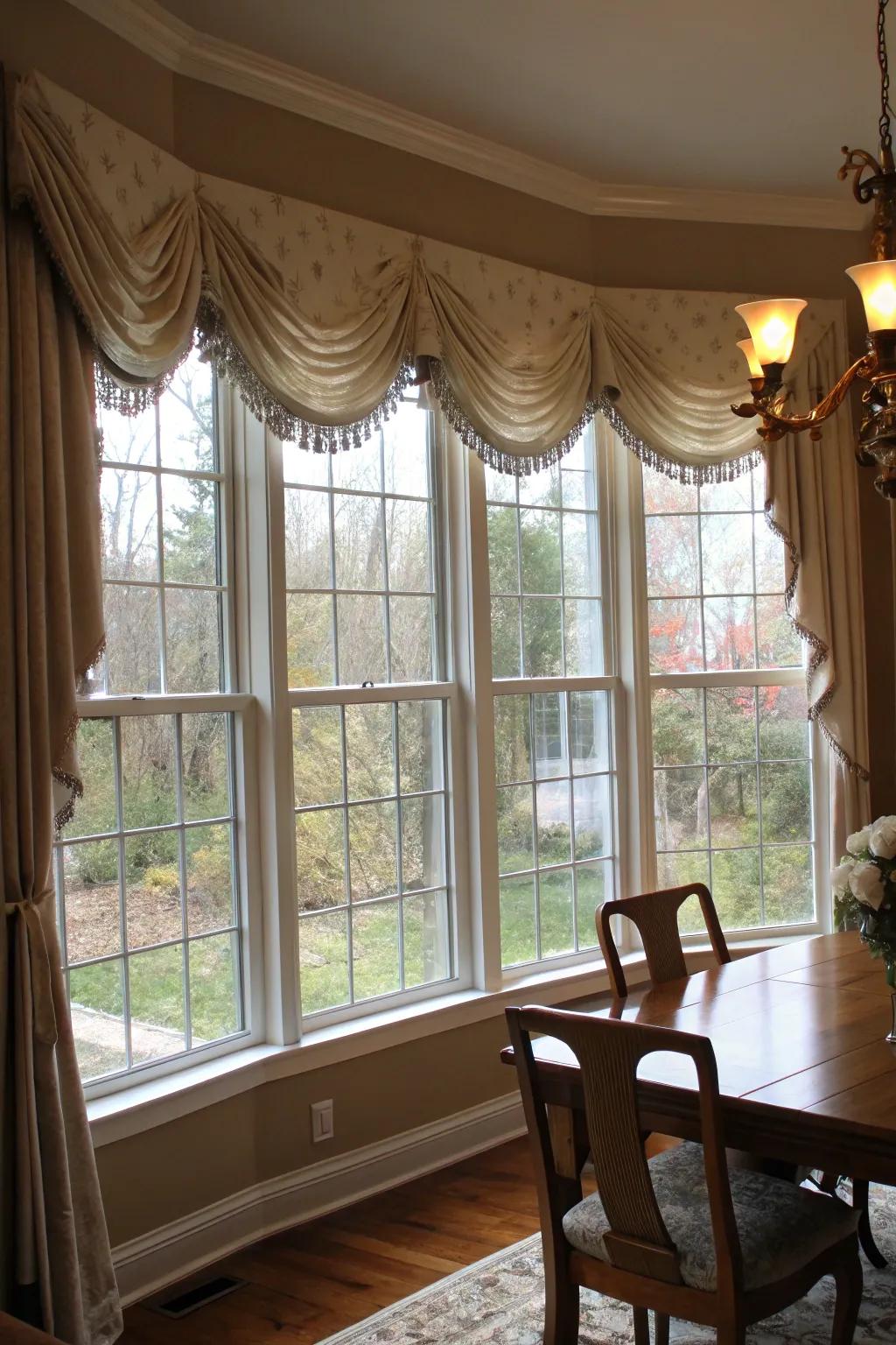 Swag window treatments offer an elegant touch to dining spaces.