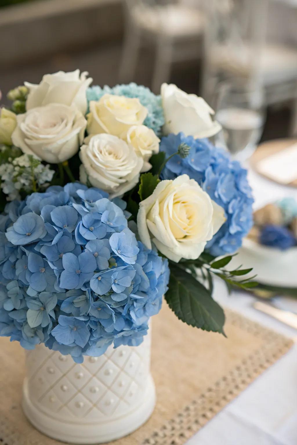 Blue hydrangeas coupled with white roses exude a timeless sophistication.