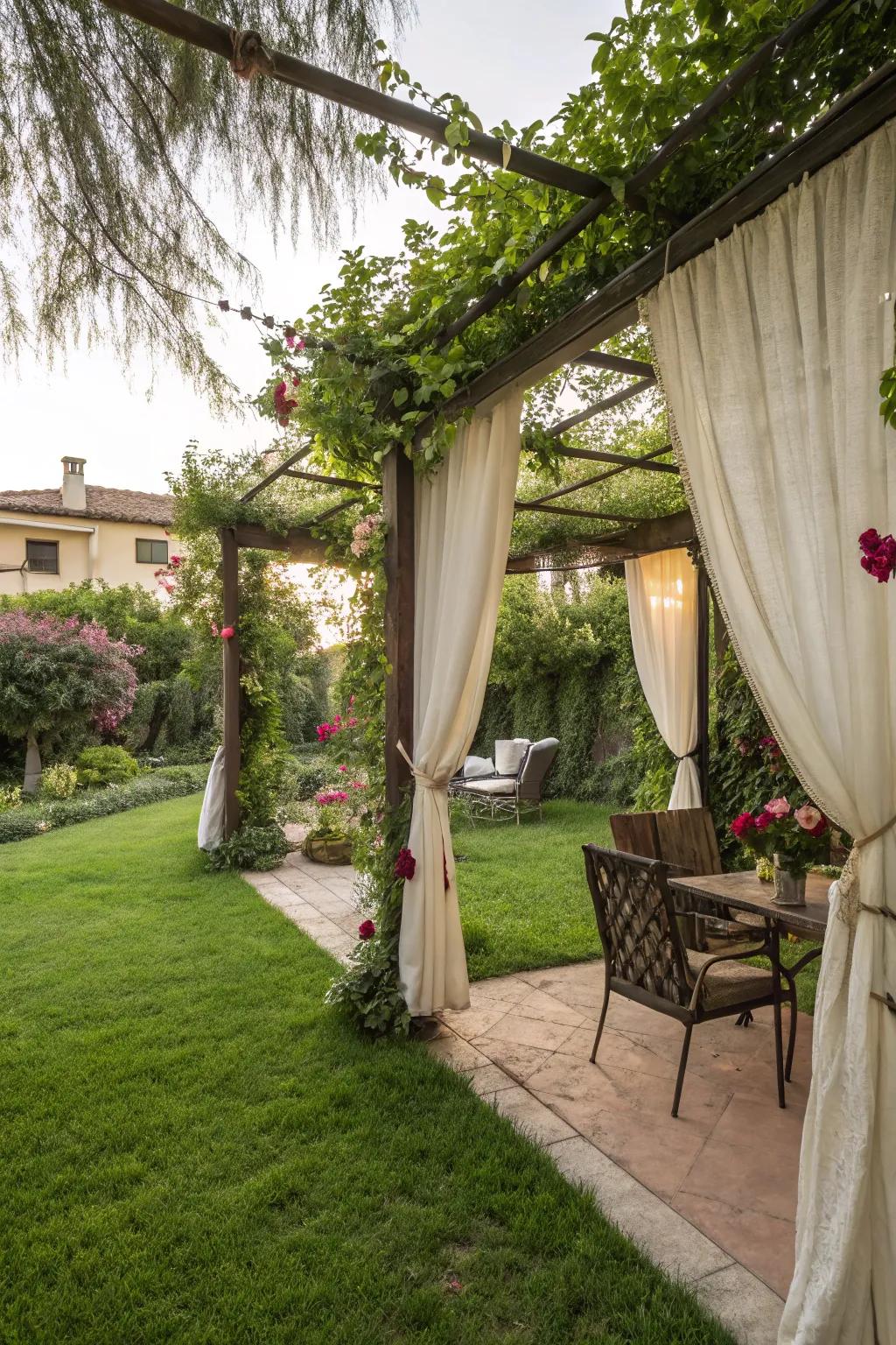 A pergola with drapes provides privacy and charm.