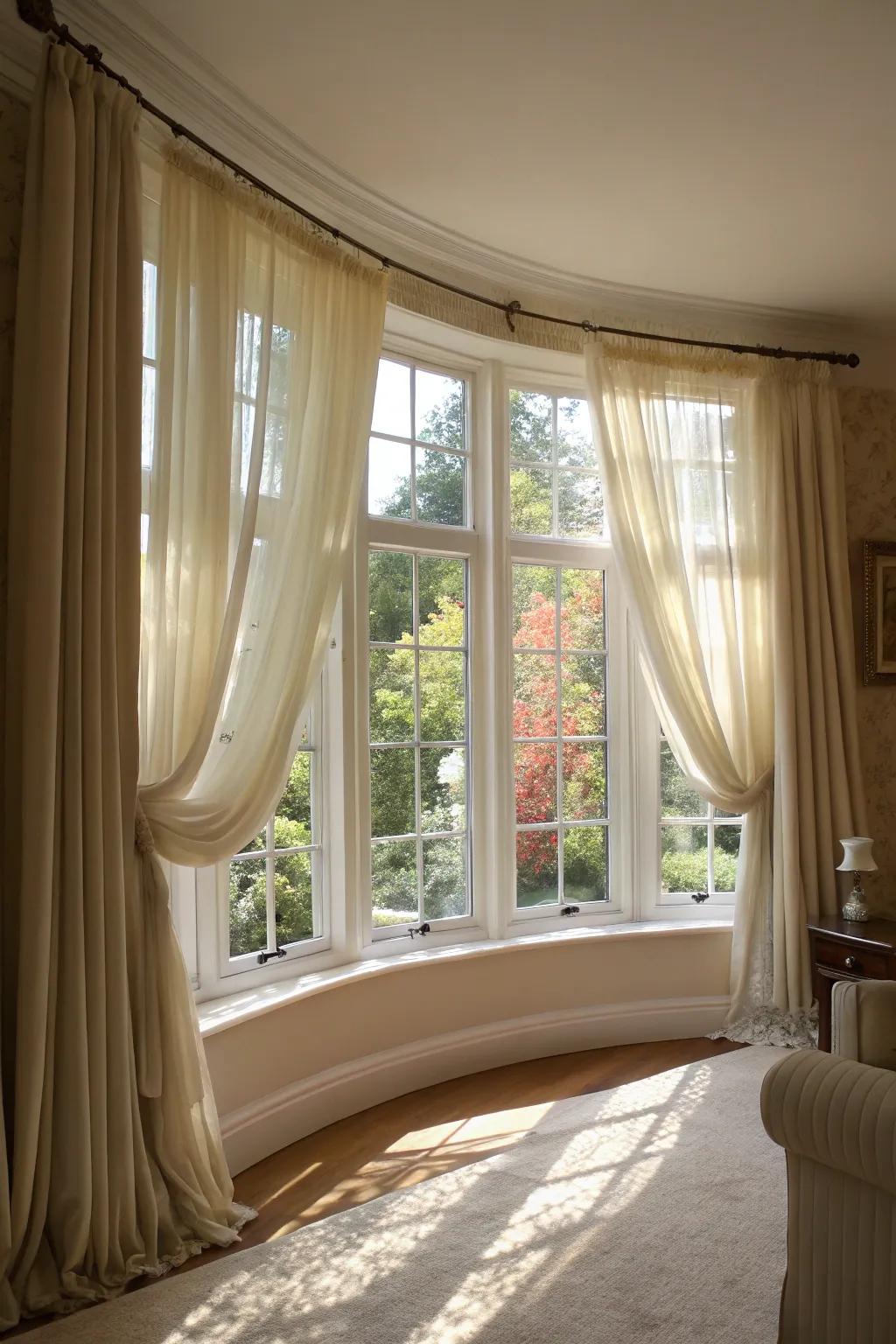 Light filtering shades amplify the natural light within an arched bay window.
