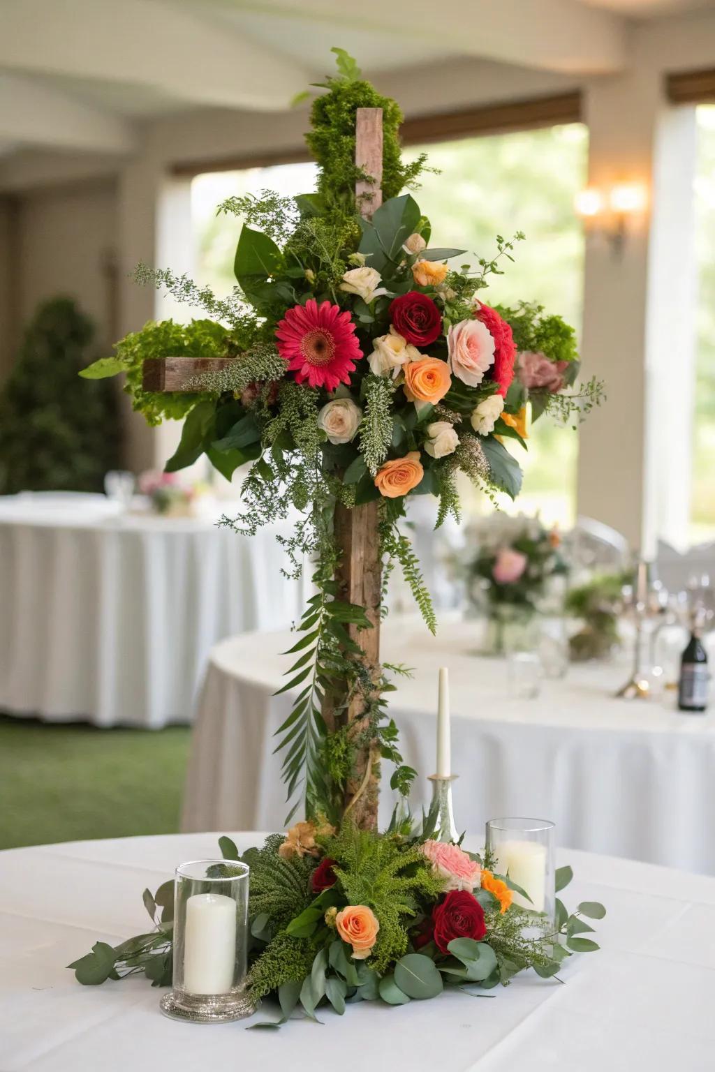 A botanical cross centerpiece brings a sophisticated and meaningful touch to the table.