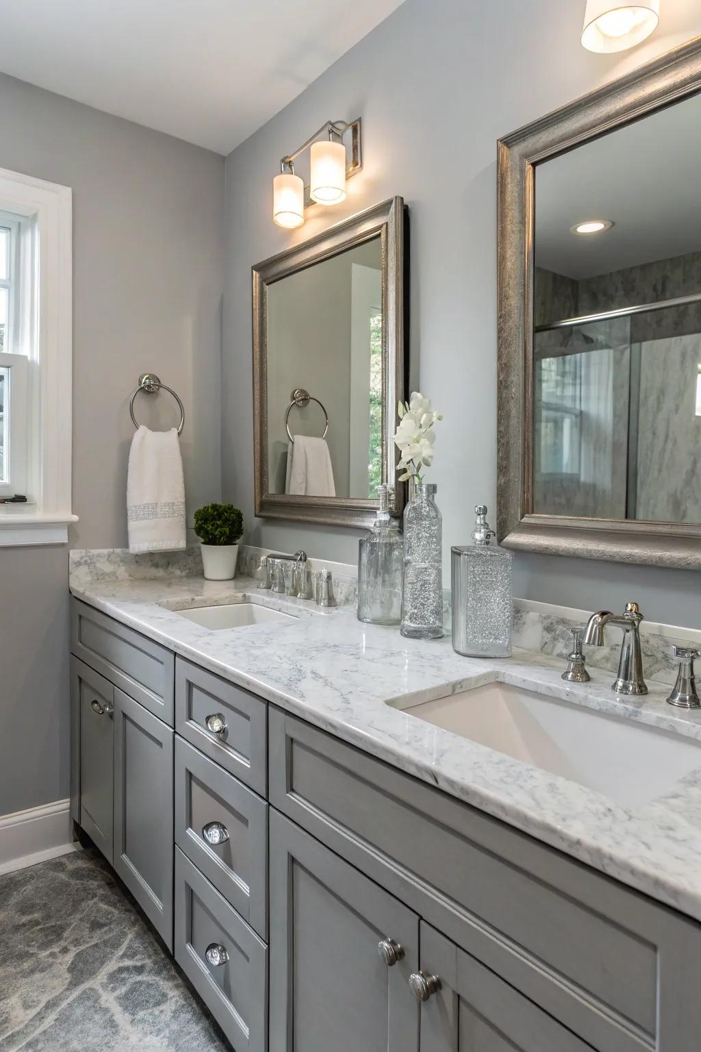 Marble and glass aspects add luxury to the grey bathroom.