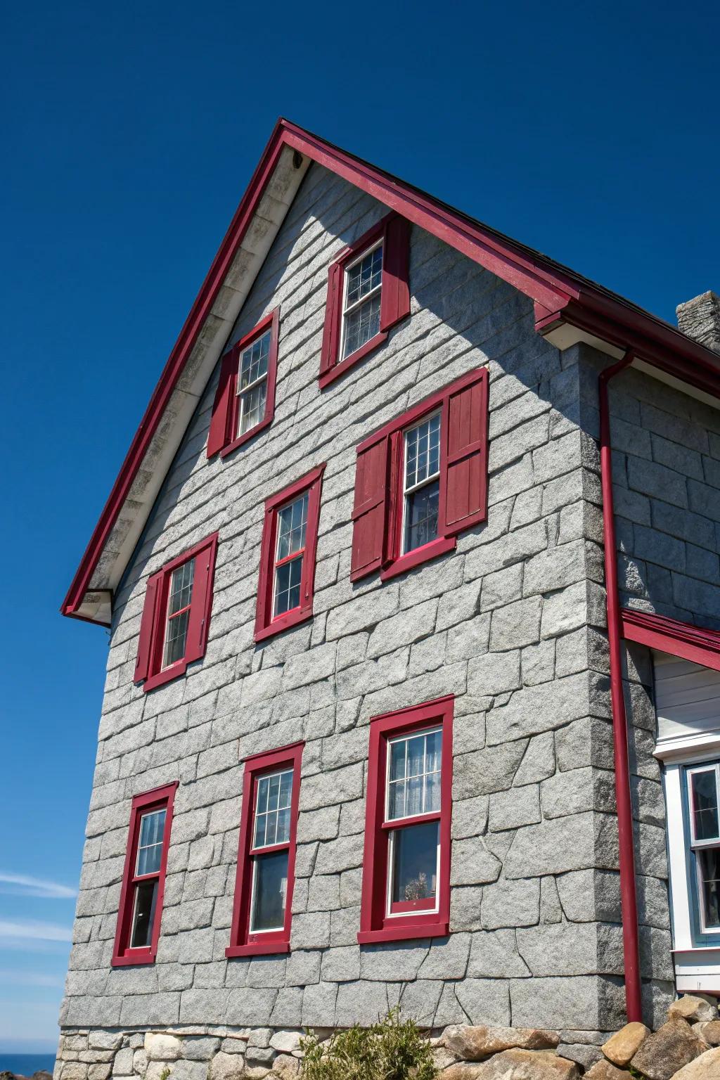 Vibrant accent shades provide a surprising contrast against this neutral stone facade.