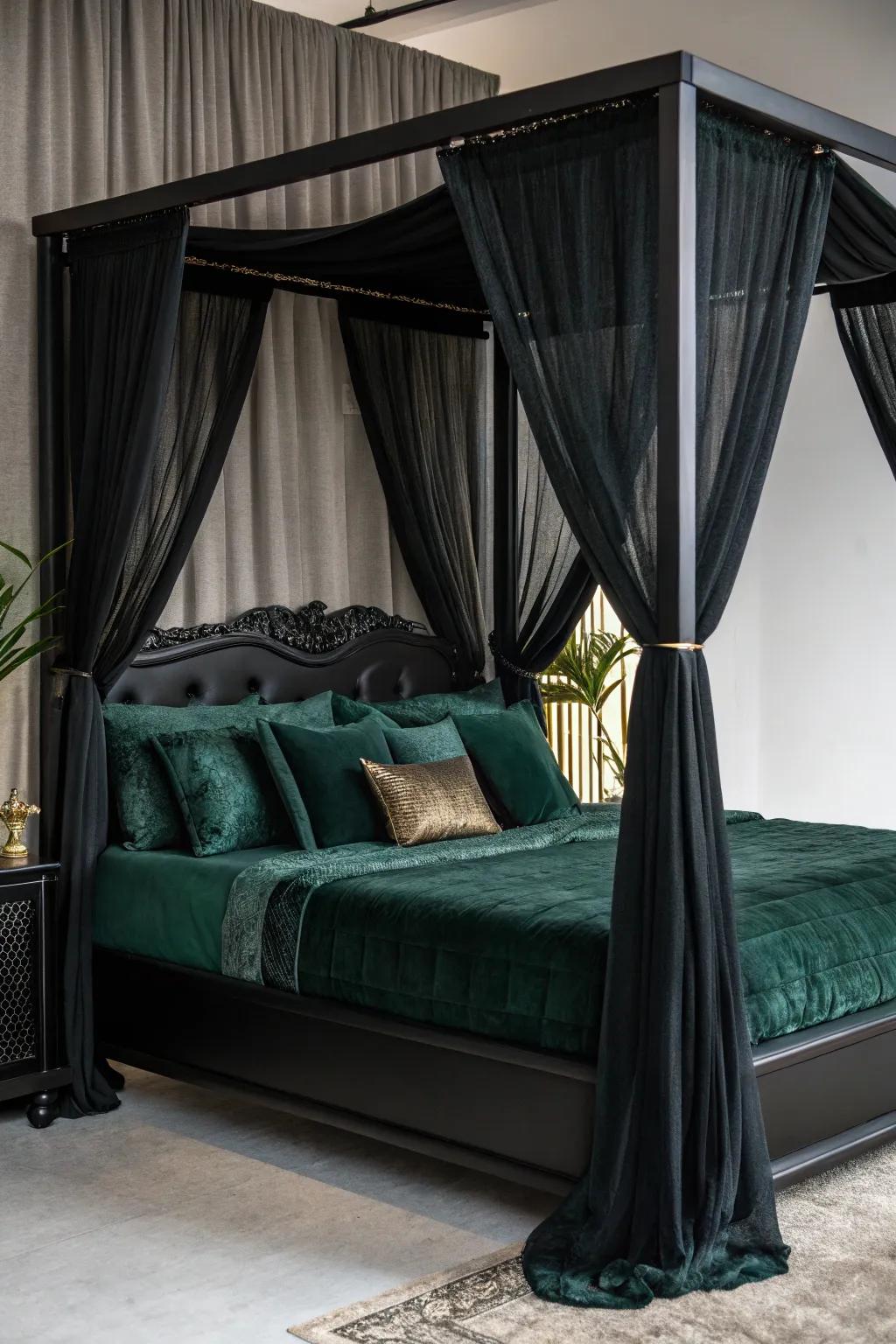 A charcoal canopy bed layered with vibrant green bedding.