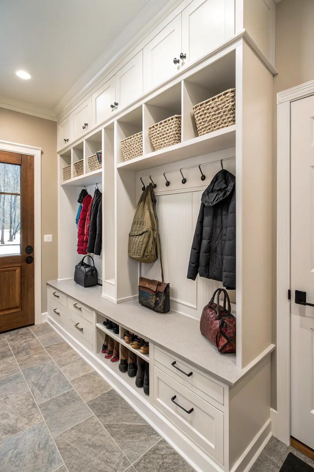 Hangers near cabinets offer easy access for hanging coats and bags.