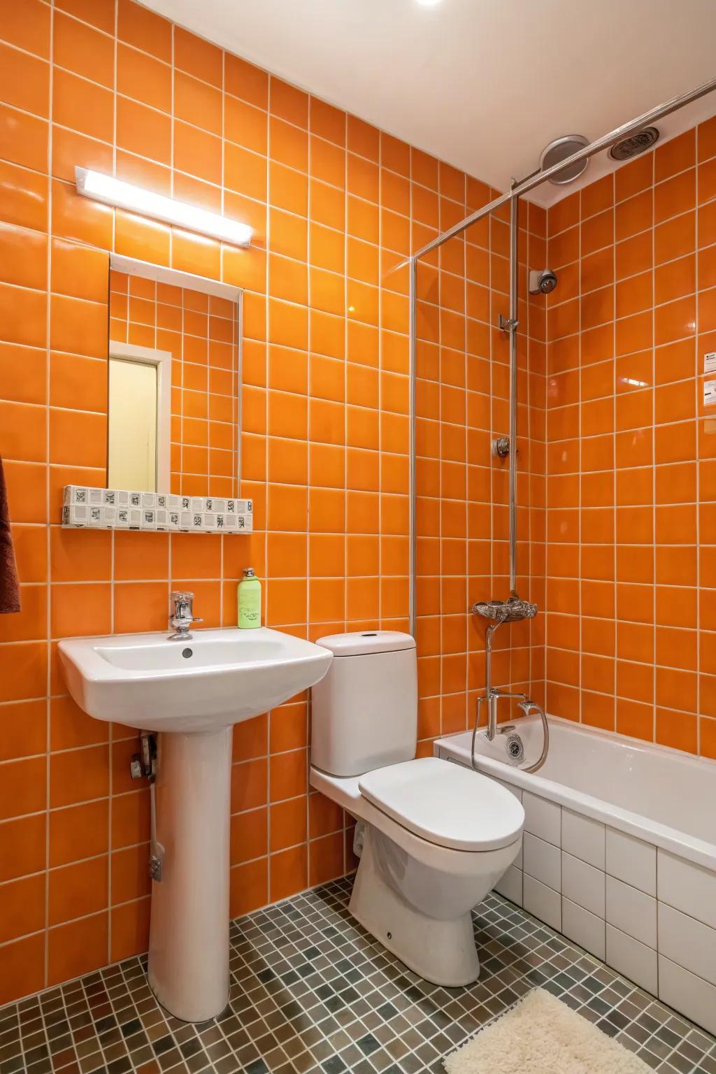 A bathroom wall covered in orange tiles adds texture and personality.