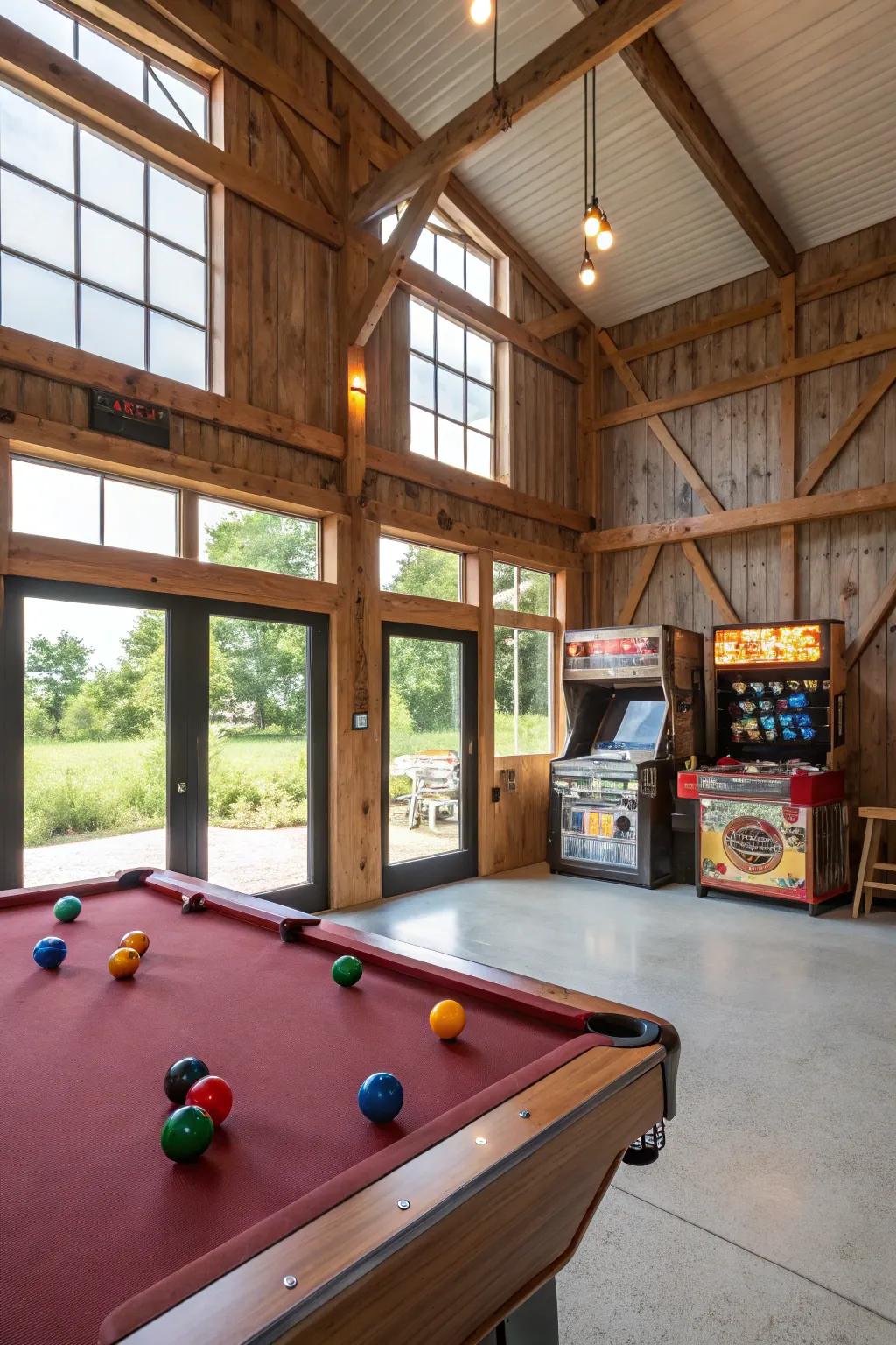 A gaming zone in a pole barn with a billiards table and classic arcade games.